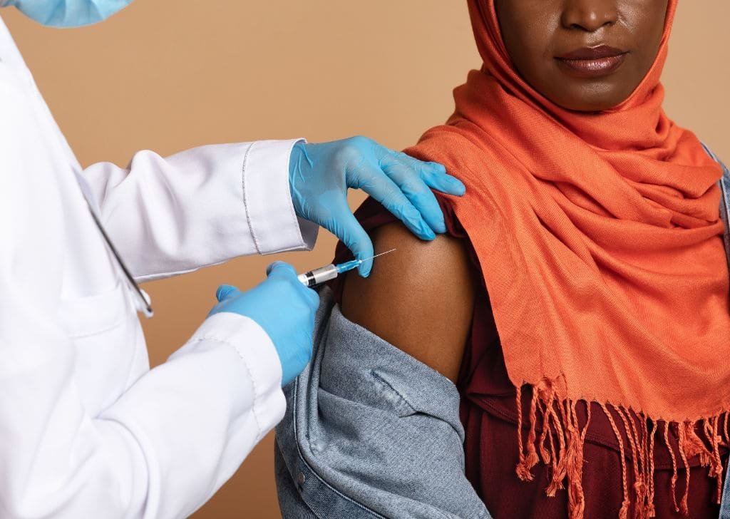 Woman getting HPV vaccine for genital warts. 