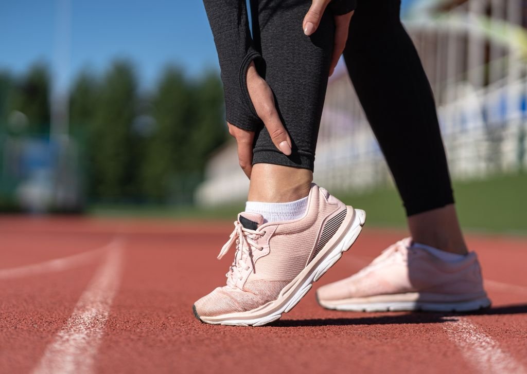 A runner suffering from pain in the Achilles Tendon.